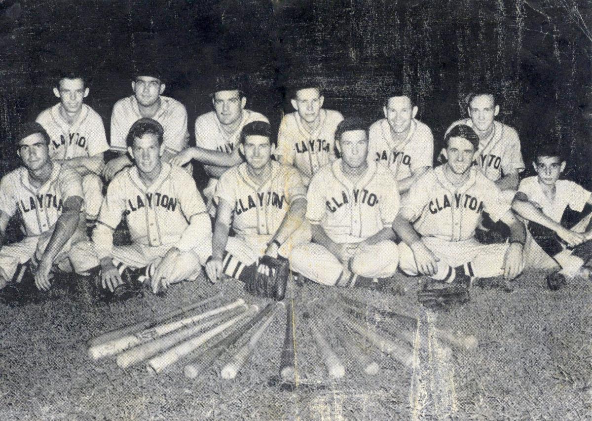 Black and white photo of twelve young men dressed in baseball uniforms that say "CLAYTON" in large capital letters across their chests.
