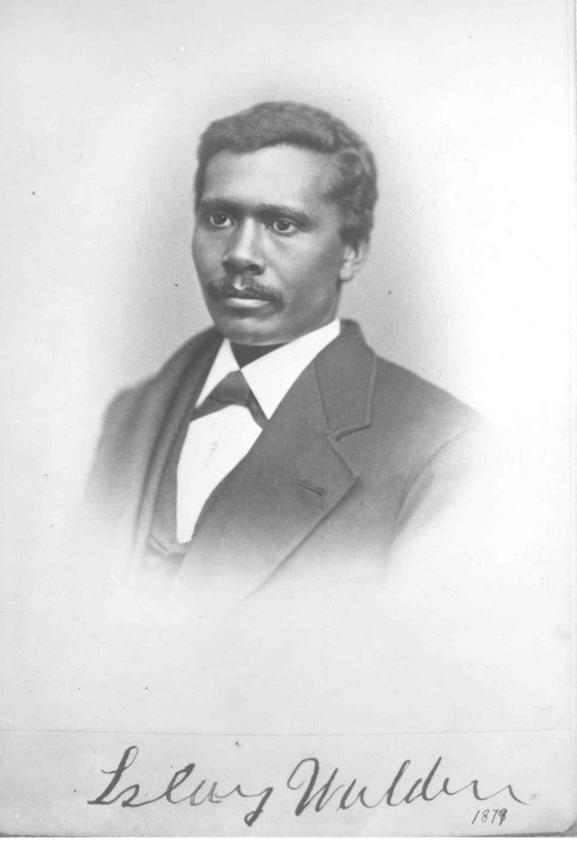 Photograph of Islay Walden circa 1879. Image courtesy of Randolph Public Library's Historical Photograph Collection. Black and white photo of a man wearing a suit. He has a calm expression on his face. Photograph is labeled "Islay Walden 1879" in cursive handwriting at bottom of image.