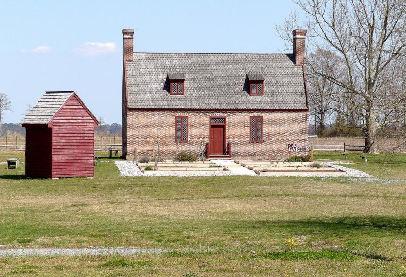 Newbold White House Newbold White House. Brick house with wood shed. It is a sunny day and the house sits on a mowed lawn.