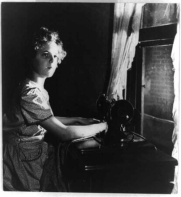 Rural electrification: Girl at sewing machine Rural electrification: Girl at sewing machine