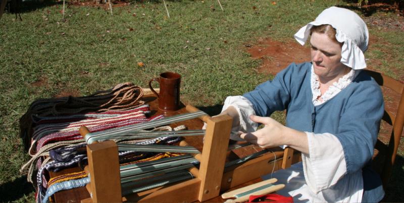 Weaving on a loom Weaving on a loom