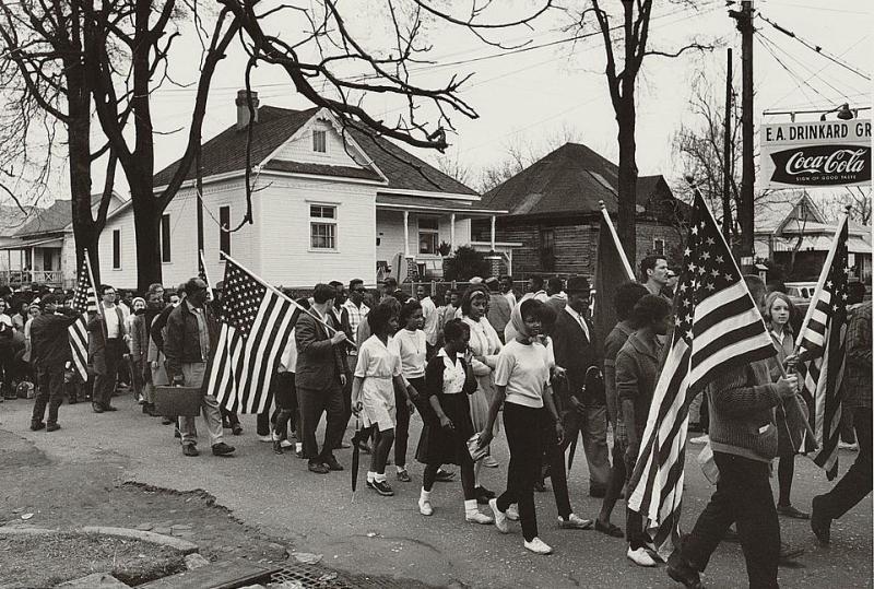 Participants, some carrying American flags, marching in the civil rights march, 1965 Participants, some carrying American flags, marching in the civil rights march, 1965