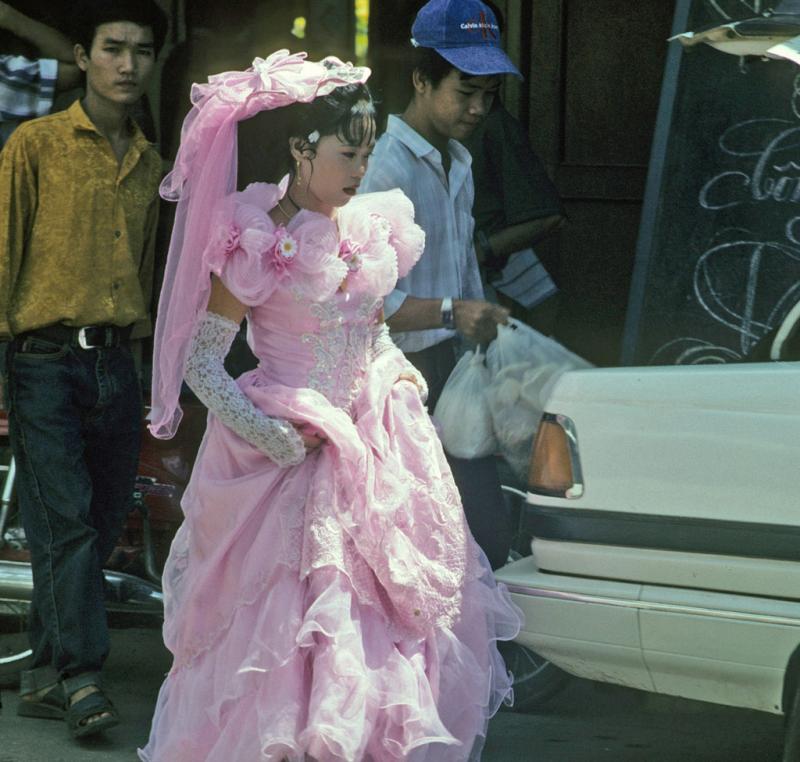 <img typeof="foaf:Image" src="http://statelibrarync.org/learnnc/sites/default/files/images/vietnam_145.jpg" width="1024" height="975" alt="Bride walks through street in lacy pink wedding dress and high gloves at Mytho" title="Bride walks through street in lacy pink wedding dress and high gloves at Mytho" /> <img typeof="foaf:Image" src="http://statelibrarync.org/learnnc/sites/default/files/images/vietnam_145.jpg" width="1024" height="975" alt="Bride walks through street in lacy pink wedding dress and high gloves at Mytho" title="Bride walks through street in lacy pink wedding dress and high gloves at Mytho" />
