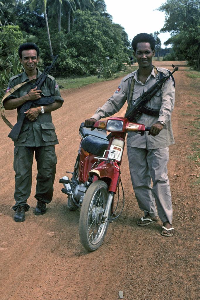 <img typeof="foaf:Image" src="http://statelibrarync.org/learnnc/sites/default/files/images/vietnam_202.jpg" width="683" height="1024" alt="Two guards with machine guns who escort tourists to Banteay Srei Temple" title="Two guards with machine guns who escort tourists to Banteay Srei Temple" /> <img typeof="foaf:Image" src="http://statelibrarync.org/learnnc/sites/default/files/images/vietnam_202.jpg" width="683" height="1024" alt="Two guards with machine guns who escort tourists to Banteay Srei Temple" title="Two guards with machine guns who escort tourists to Banteay Srei Temple" />