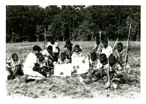 Boyscouts learning about native plants and animals at Crabtree Creek or Reedy Creek State Park, ca. 1940s to 1950s. Crabtree Creek had two park entrances during segregation. In 1950, the southern entrance at Reedy Creek and its surrounding 1,234 acres were split into a separate state park exclusively for African Americans. North Carolina State Parks Collection, NC Digital Collections. Boyscouts learning about native plants and animals at Crabtree Creek or Reedy Creek State Park, ca. 1940s to 1950s. Crabtree Creek had two park entrances during segregation. In 1950, the southern entrance at Reedy Creek and its surrounding 1,234 acres were split into a separate state park exclusively for African Americans. North Carolina State Parks Collection, NC Digital Collections.