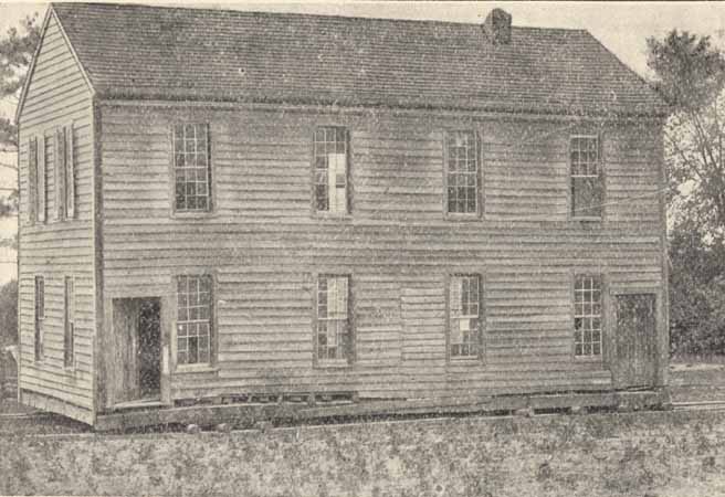 A destitute, two-story building. 