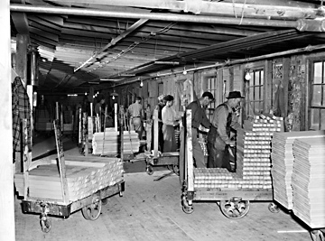 Jennings Furniture Company, Lenoir, NC (Caldwell County); assembling and crating bedroom furniture, 1940s, photo by Patrick. From North Carolina Conservation and Development Department, Travel and Tourism Division photo files, North Carolina State Archives, call #: ConDev3192C. Jennings Furniture Company, Lenoir, NC (Caldwell County); assembling and crating bedroom furniture, 1940s, photo by Patrick. From North Carolina Conservation and Development Department, Travel and Tourism Division photo files, North Carolina State Archives, call #: ConDev3192C.